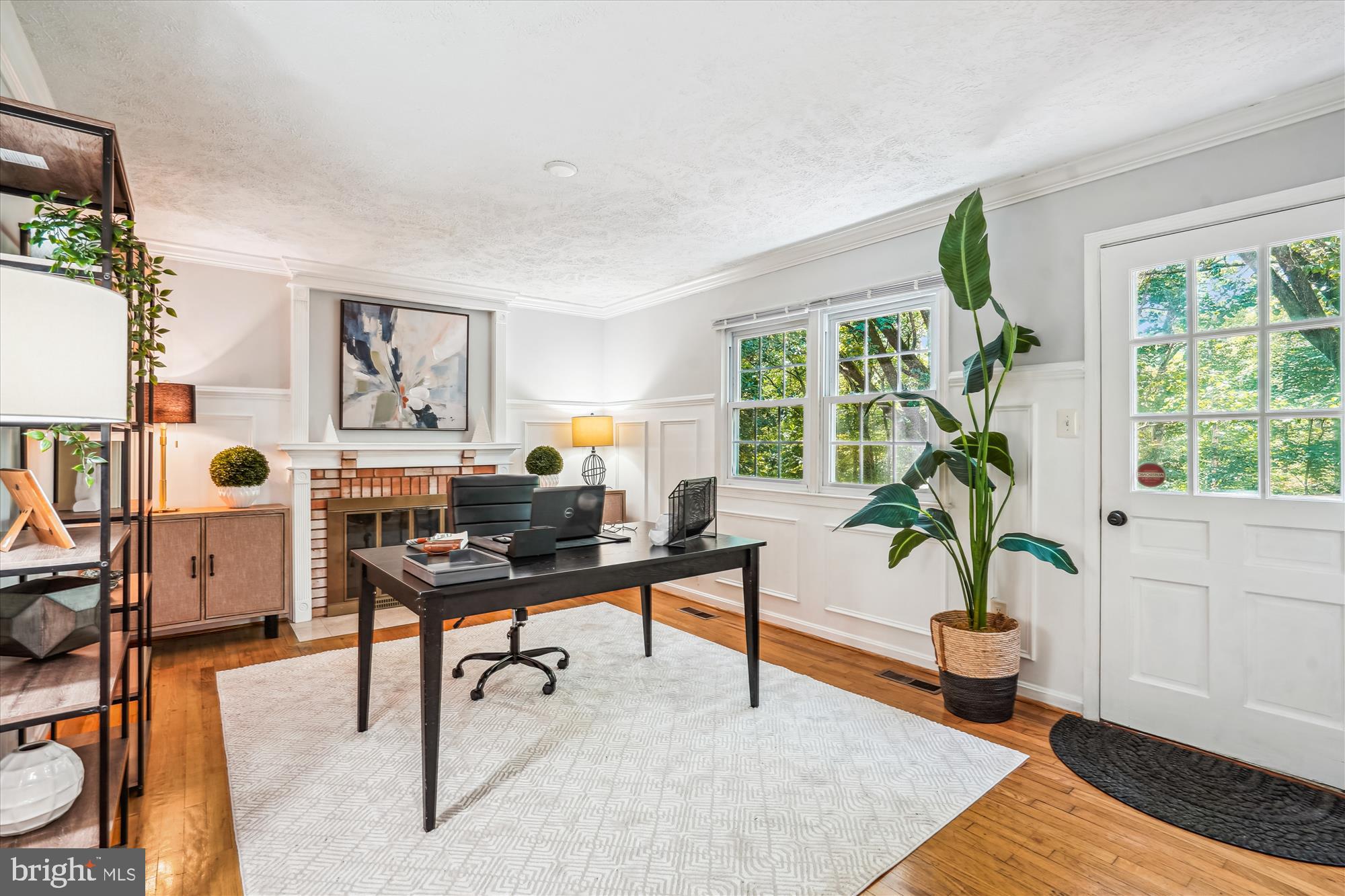 8322 Cushing Court Springfield, VA 22153 - Photo 13 of 57 a view of a workspace with furniture and a potted plant