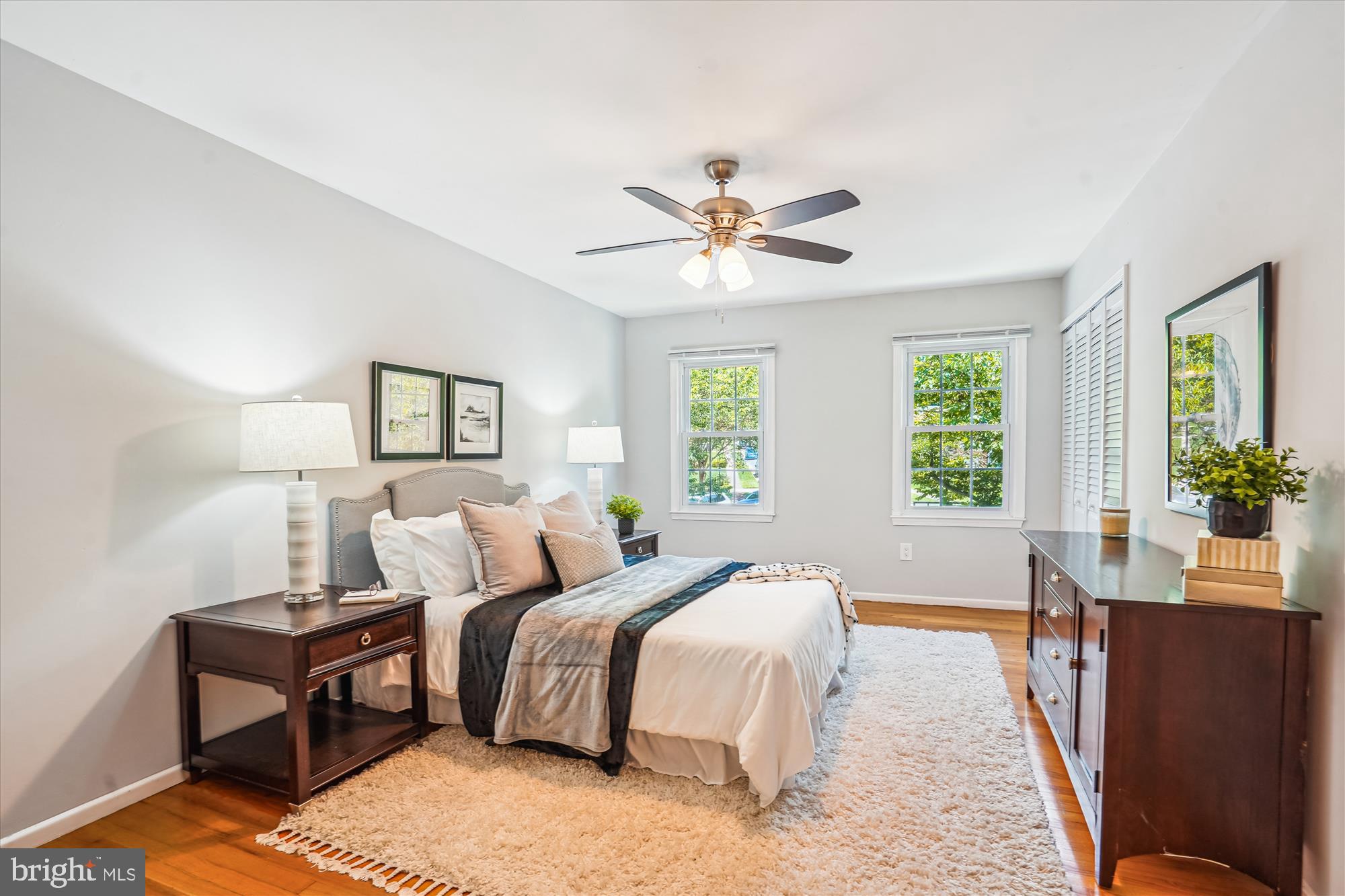 8322 Cushing Court Springfield, VA 22153 - Photo 15 of 57 a bed room with a bed a couch and a large window