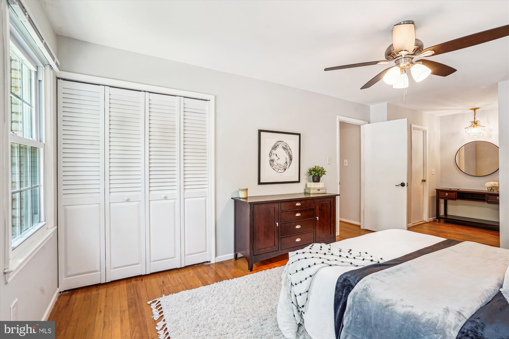 8322 Cushing Court Springfield, VA 22153 - Photo 16 of 57 a bedroom with a bed and wooden floor