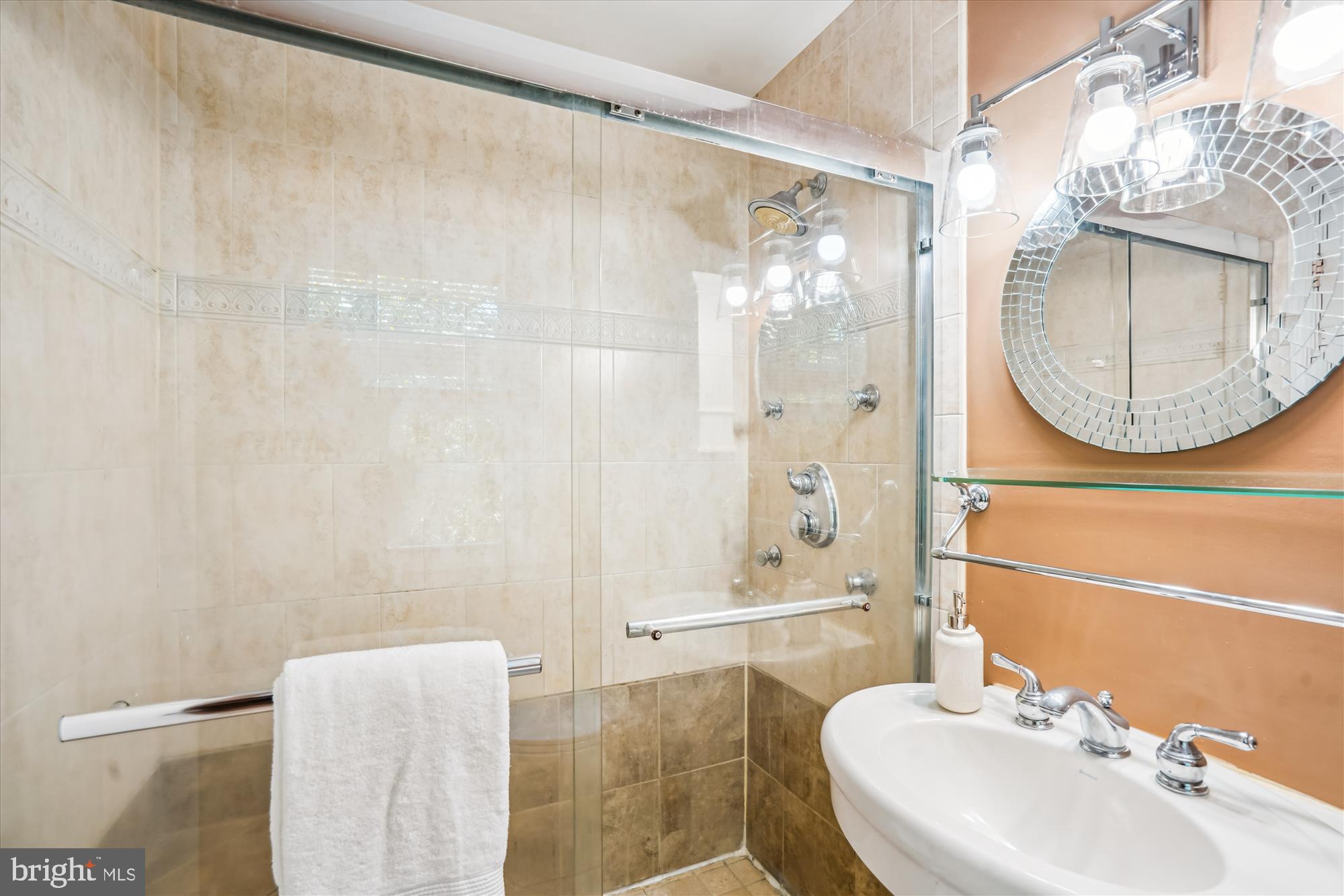 8322 Cushing Court Springfield, VA 22153 - Photo 17 of 57 a bathroom with a sink and a mirror