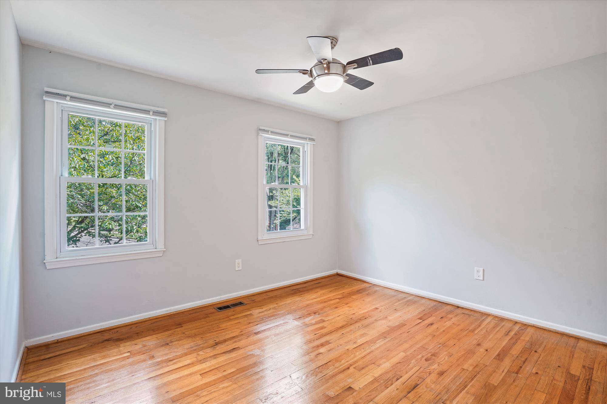 8322 Cushing Court Springfield, VA 22153 - Photo 22 of 57 a view of empty room with wooden floor and fan
