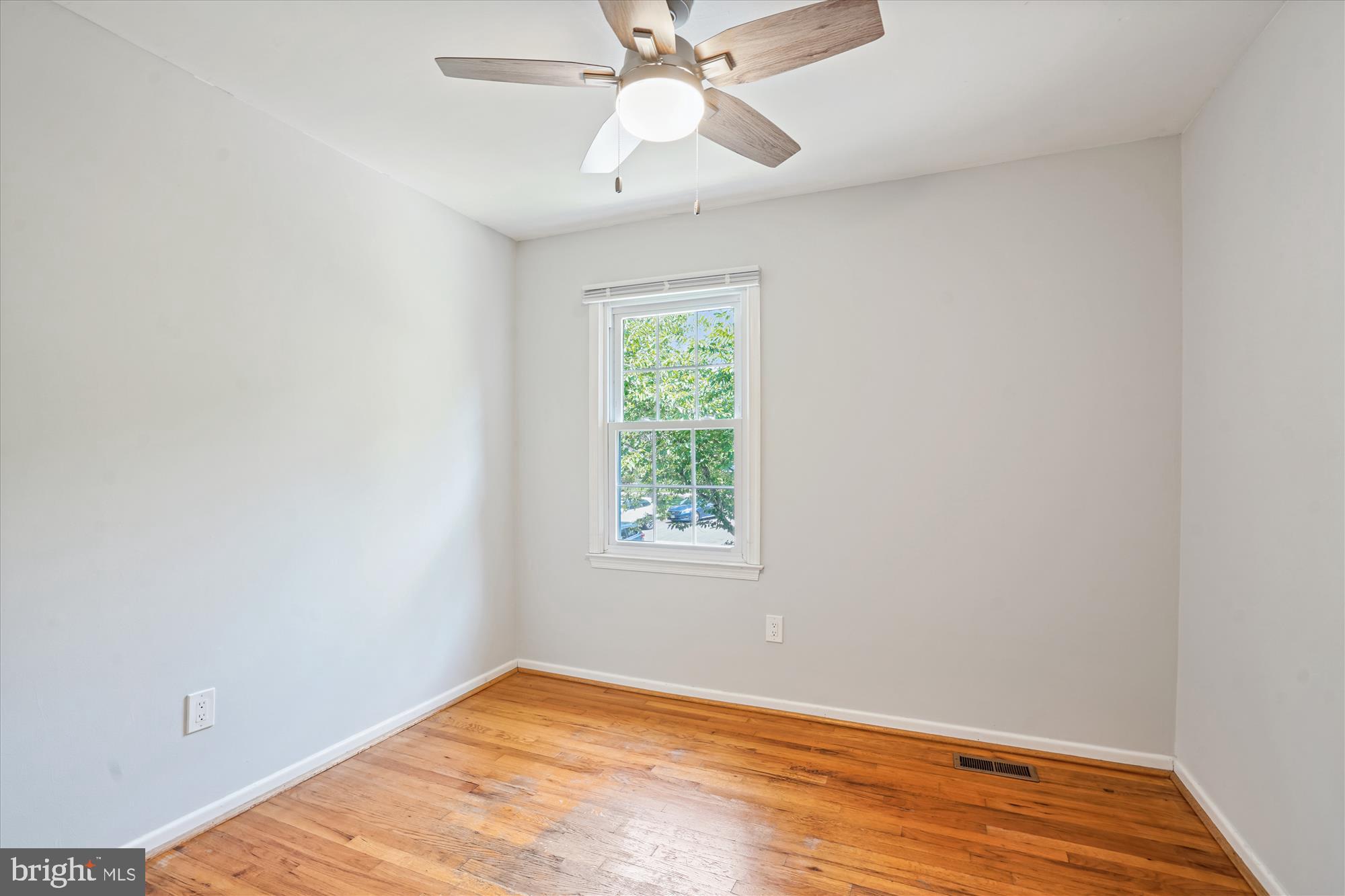 8322 Cushing Court Springfield, VA 22153 - Photo 24 of 57 an empty room with a window and a chandelier fan
