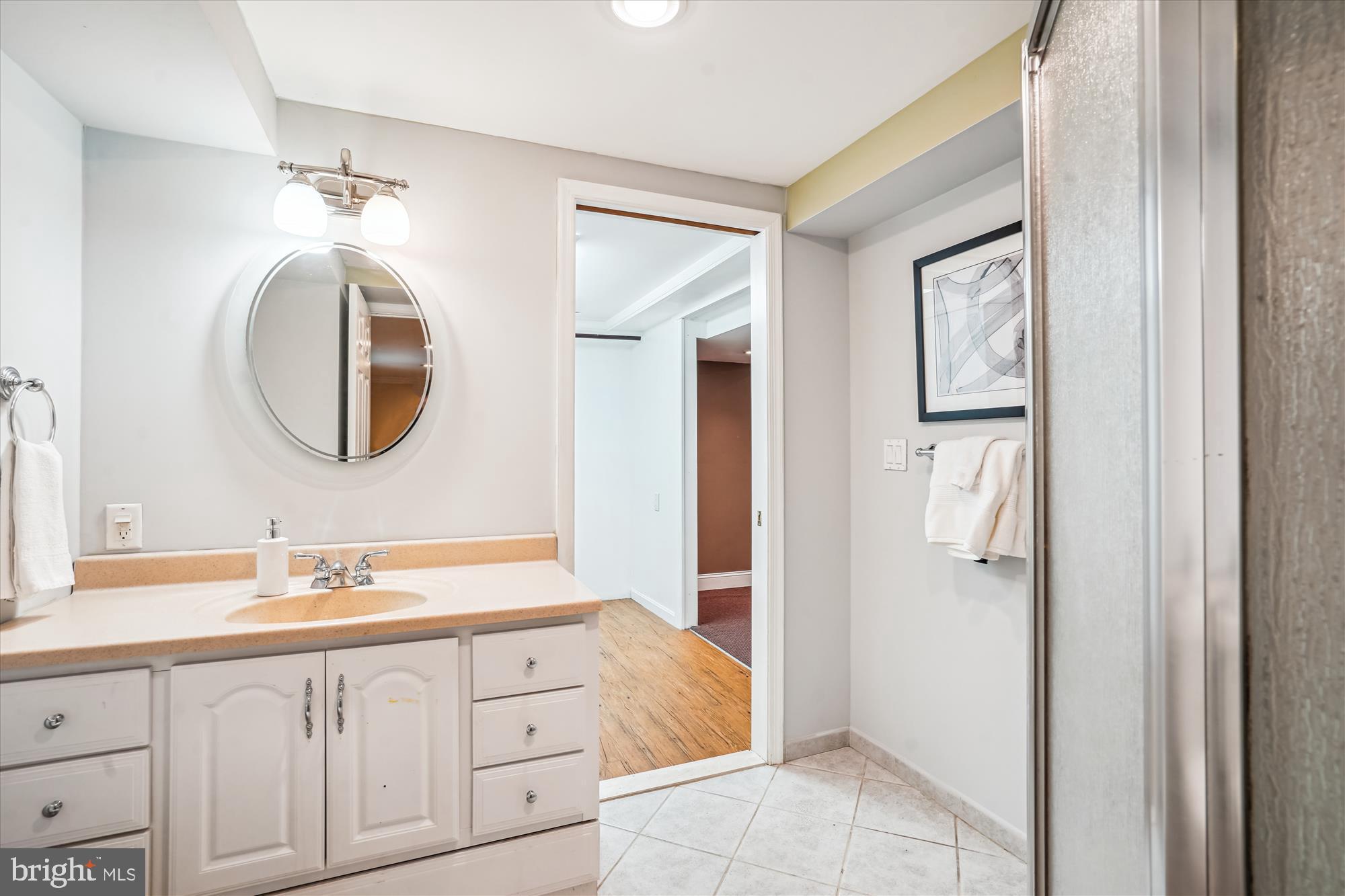 8322 Cushing Court Springfield, VA 22153 - Photo 29 of 57 a bathroom with a double vanity sink and a mirror