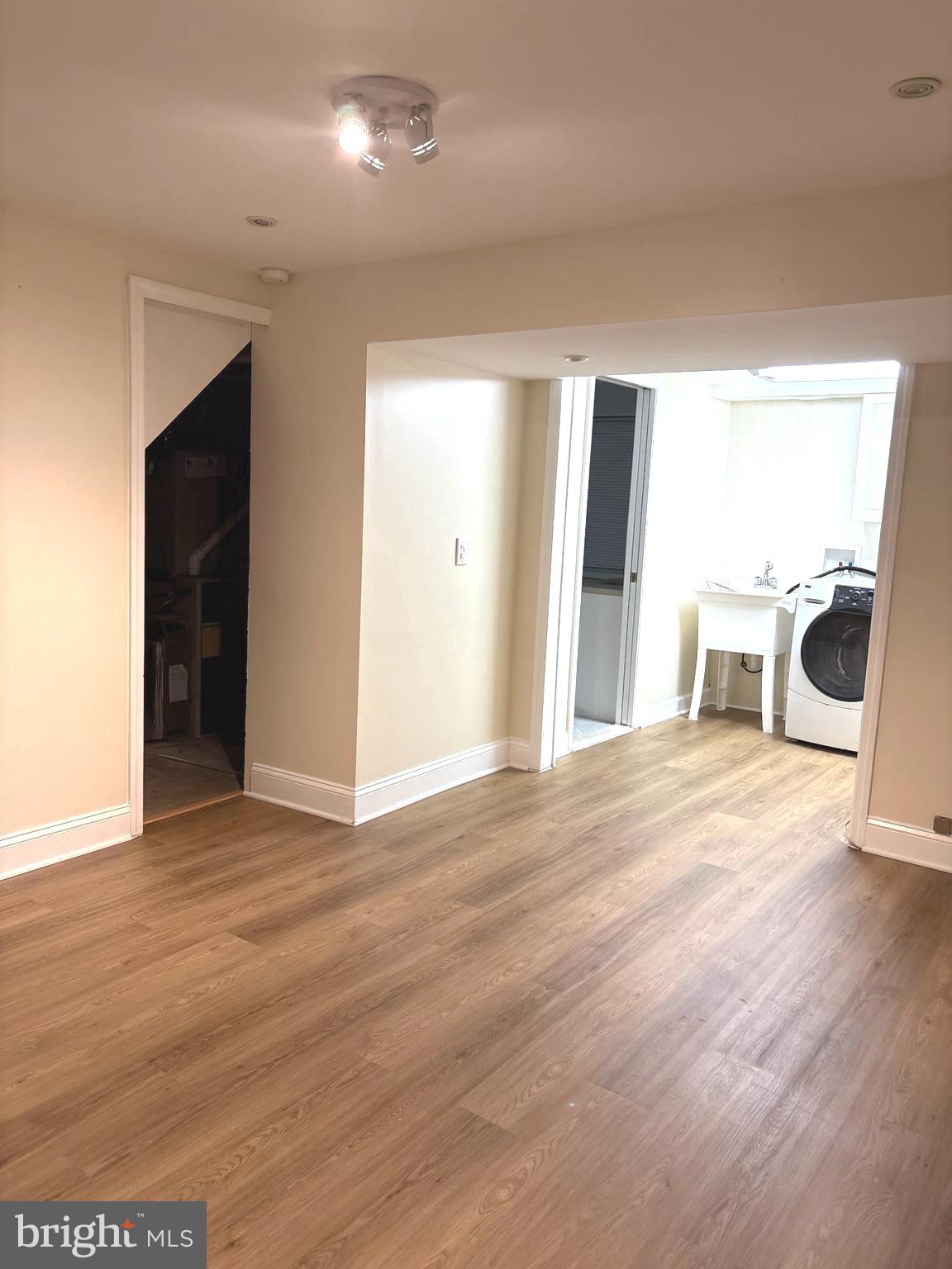 8322 Cushing Court Springfield, VA 22153 - Photo 32 of 57 an empty room with wooden floor and windows