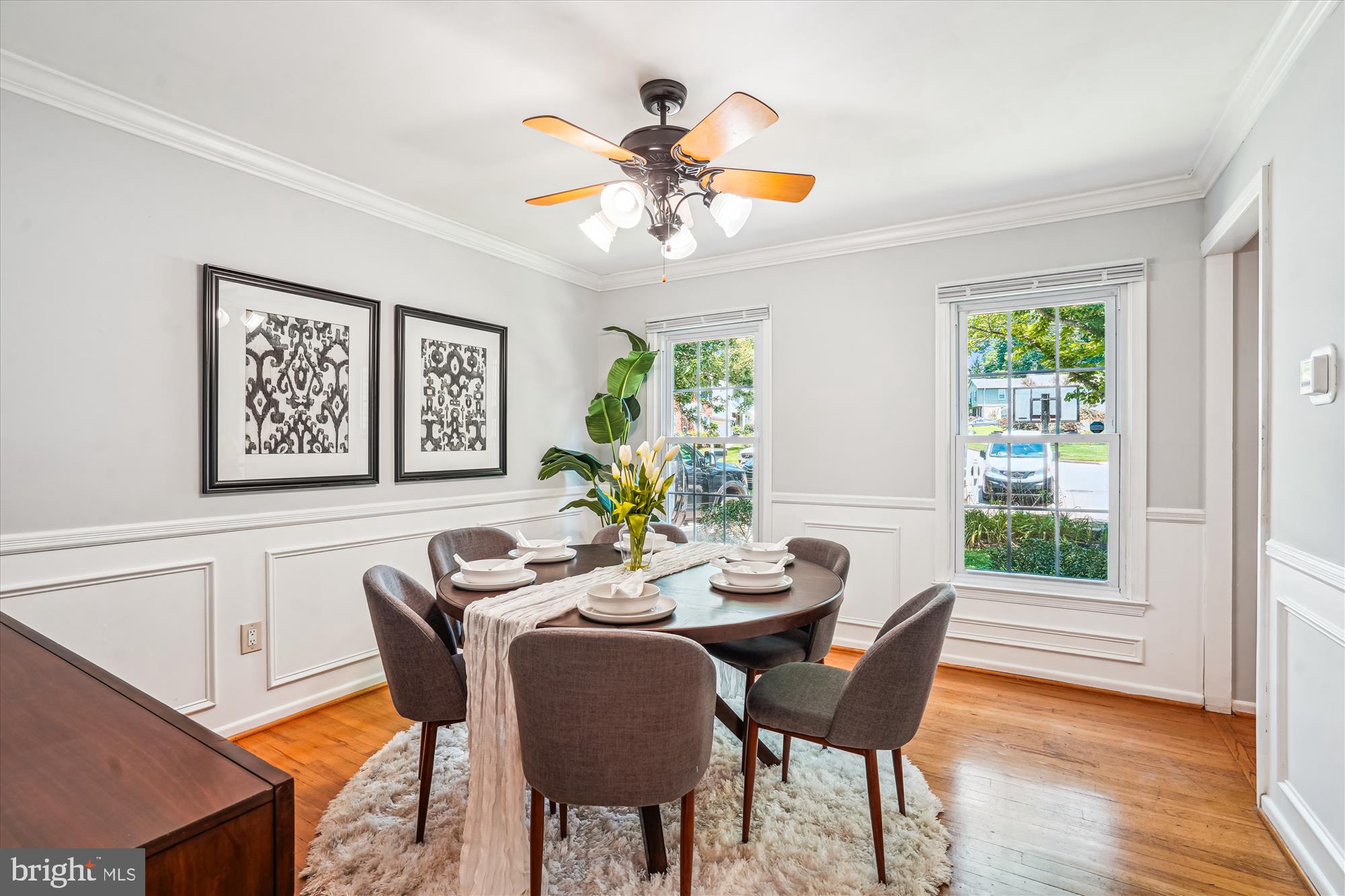 8322 Cushing Court Springfield, VA 22153 - Photo 7 of 57 a dining room with furniture a window and wooden floor