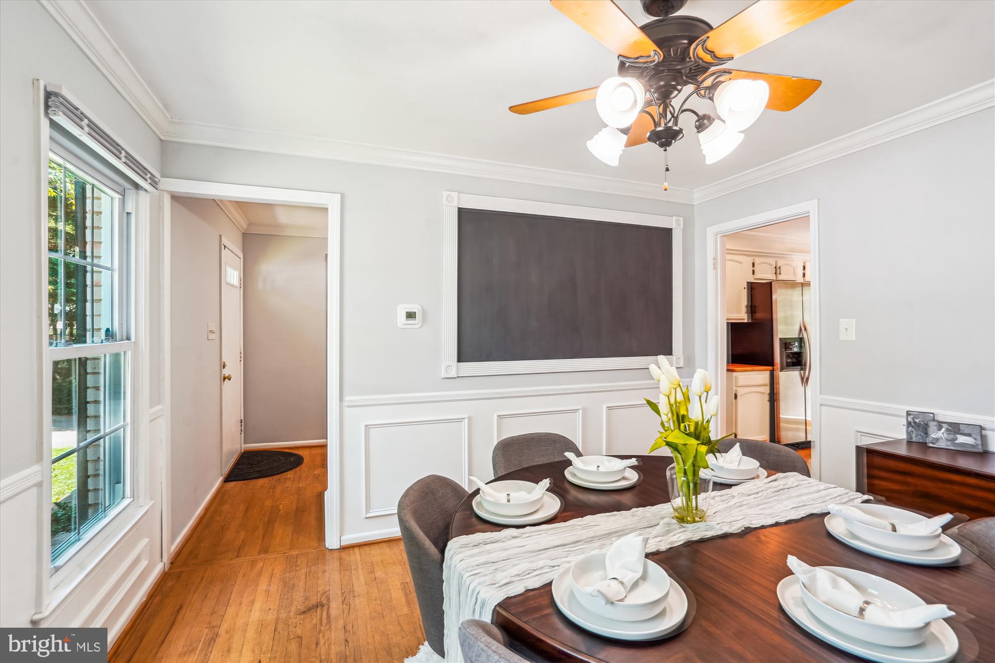 8322 Cushing Court Springfield, VA 22153 - Photo 8 of 57 a living room with furniture and a chandelier
