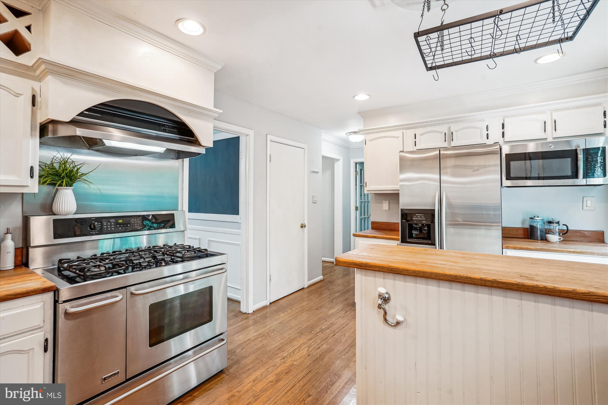 8322 Cushing Court Springfield, VA 22153 - Photo 10 of 57 a kitchen with stainless steel appliances granite countertop a stove and a refrigerator