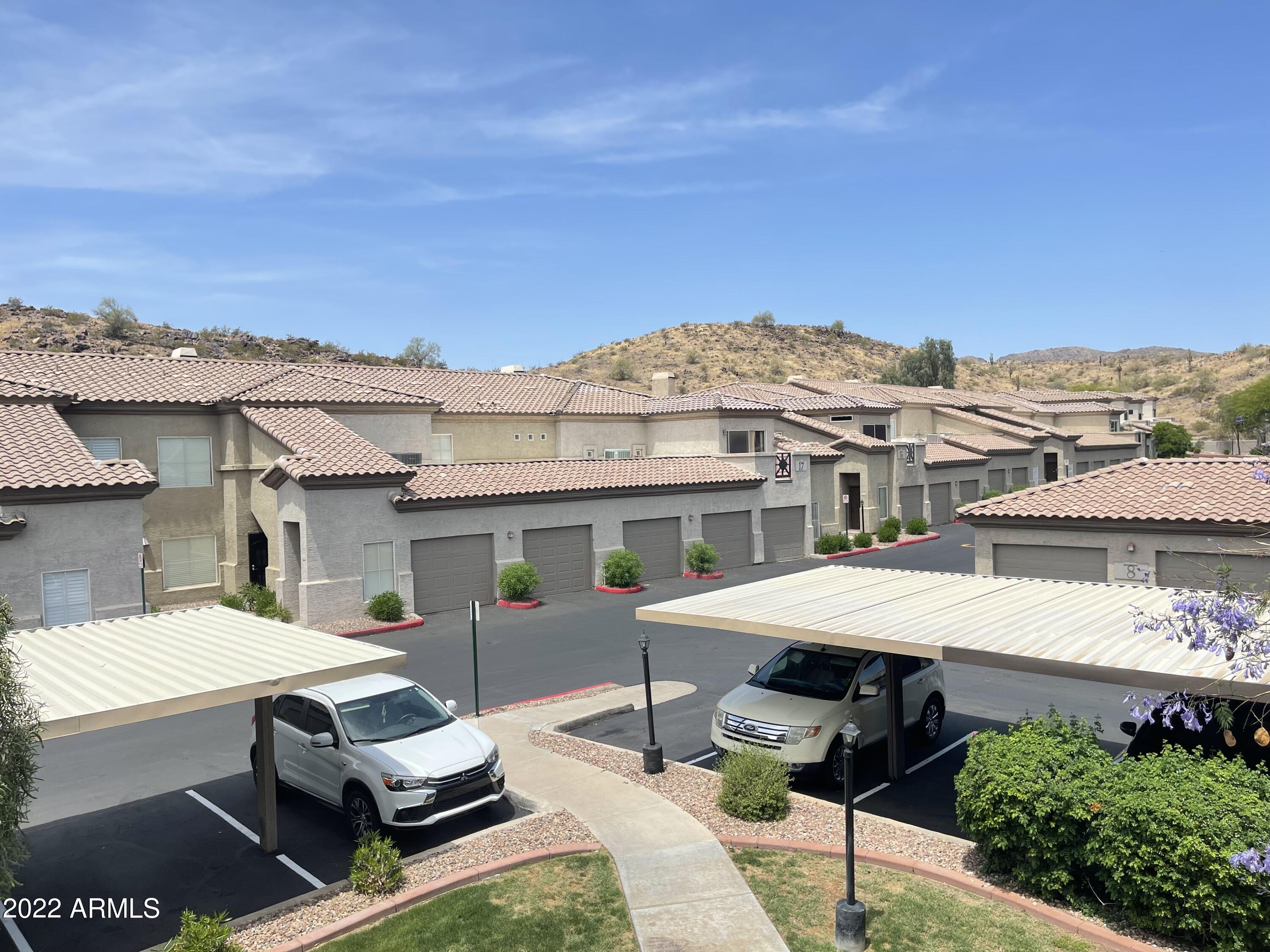 3236 East Chandler Boulevard, Unit 2093 Phoenix, AZ 85048 - Photo 23 of 28 a aerial view of a house with swimming pool and sitting area