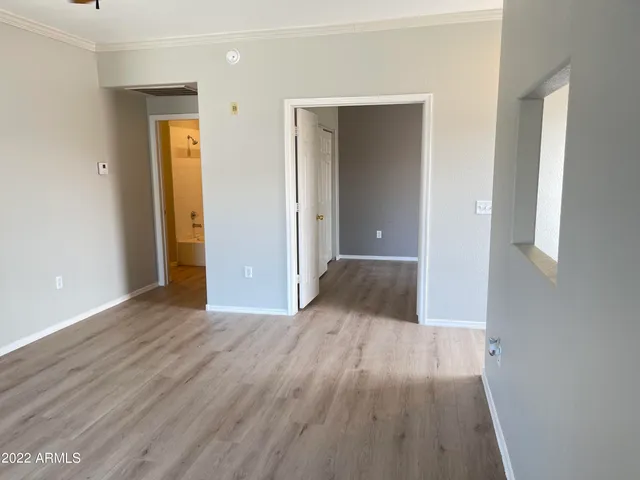 wooden floor in a hall with an empty room