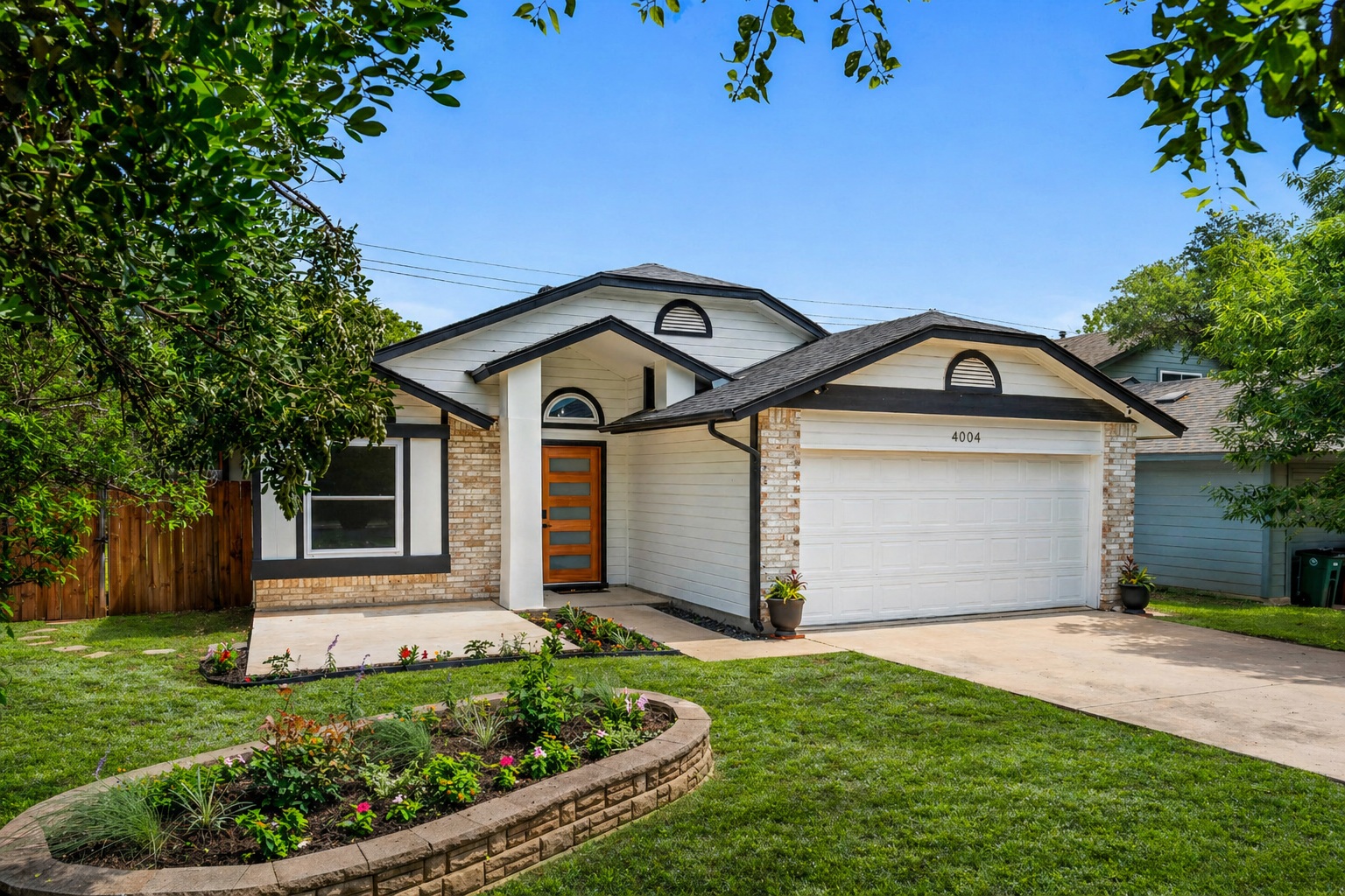 4004 Danli Lane Austin, TX 78749 - Photo 1 of 40 a front view of a house with a yard