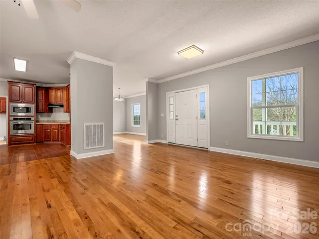 a view of a livingroom with wooden floor