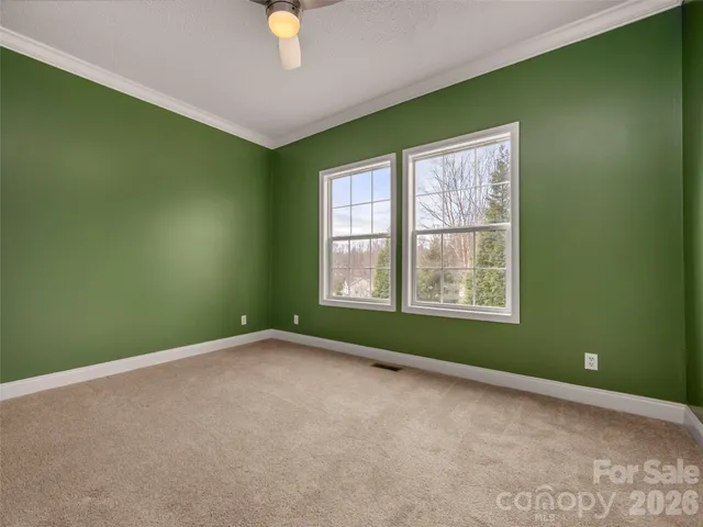 a view of an empty room with windows