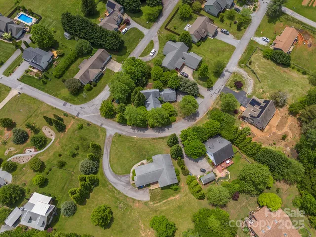 an aerial view of a house with a garden