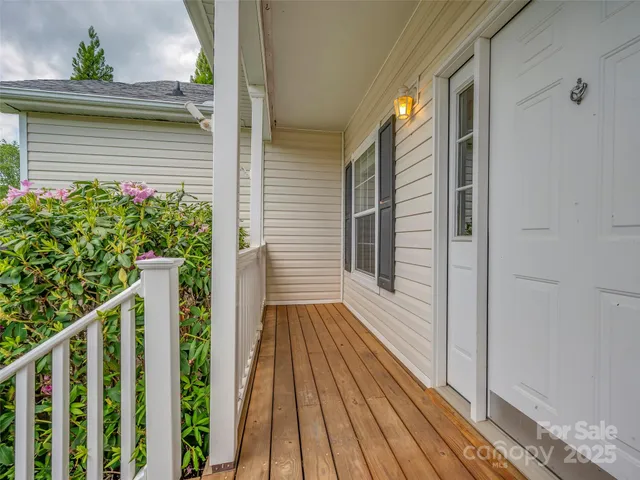 a view of balcony with wooden floor