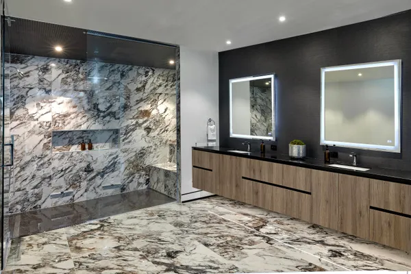 a bathroom with a bathtub and shower