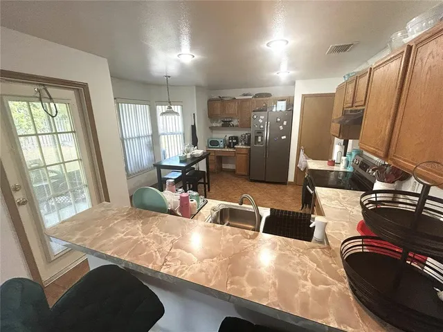 a view of a living room and a kitchen