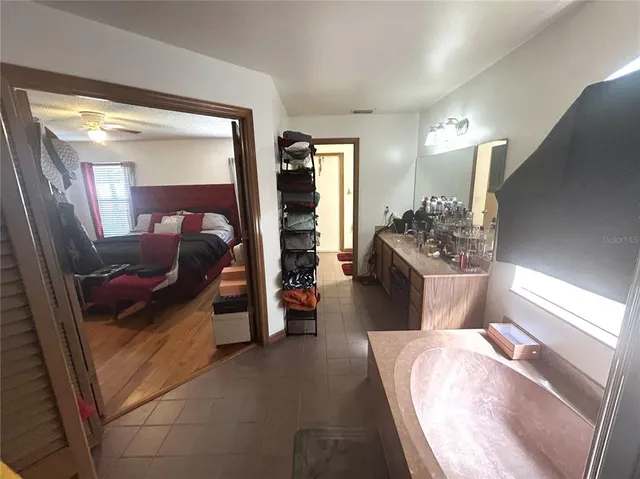 a living room with furniture and a balcony