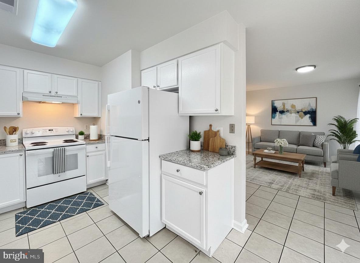 102 Crossbill Way Frederick, MD 21702 - Photo 4 of 16 a kitchen with white cabinets and white appliances