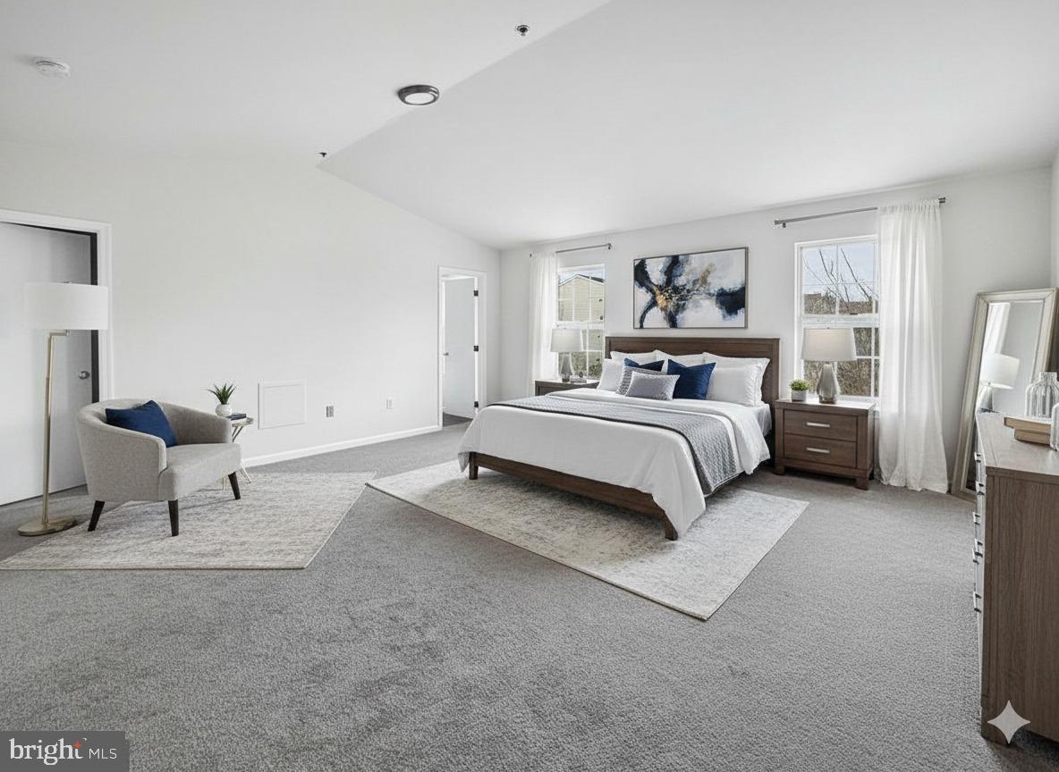 102 Crossbill Way Frederick, MD 21702 - Photo 7 of 16 a spacious bedroom with a bed and a couch