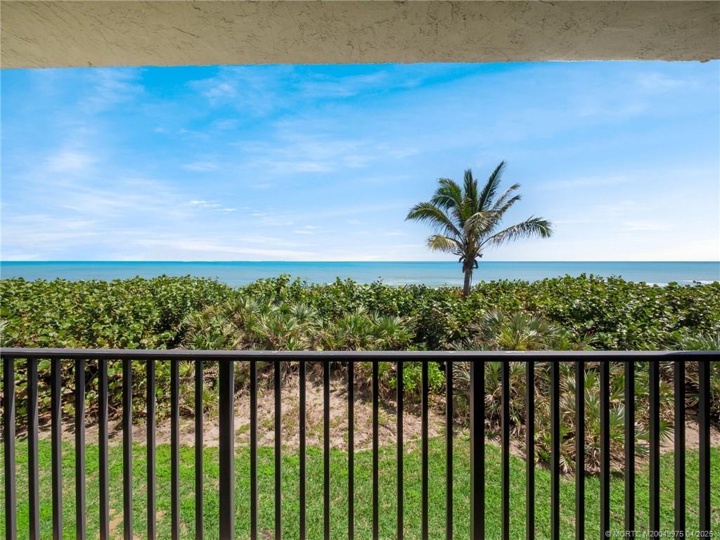 7380 South Ocean Drive, Unit 220 Jensen Beach, FL 34957 - Photo 2 of 33 a view of a balcony with wooden fence