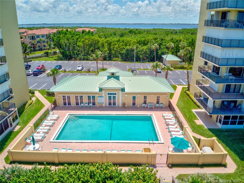 7380 South Ocean Drive, Unit 220 Jensen Beach, FL 34957 - Photo 21 of 33 an aerial view of a chairs and table on the terrace