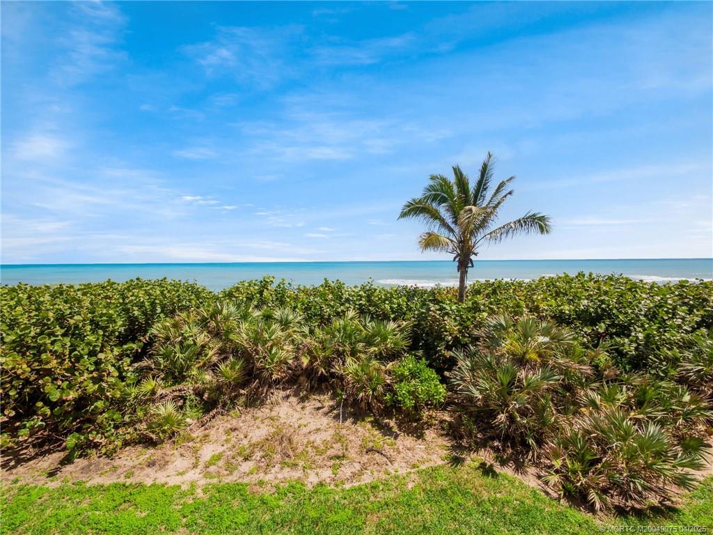 7380 South Ocean Drive, Unit 220 Jensen Beach, FL 34957 - Photo 3 of 33 a view of a garden