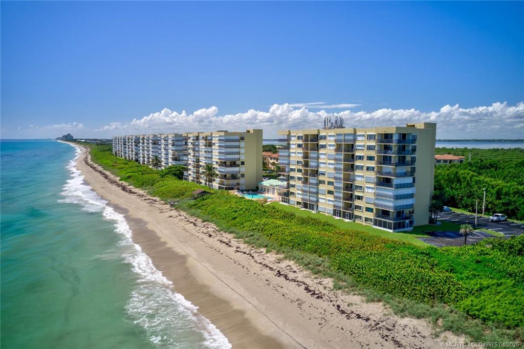7380 South Ocean Drive, Unit 220 Jensen Beach, FL 34957 - Photo 33 of 33 a view of a city with tall buildings