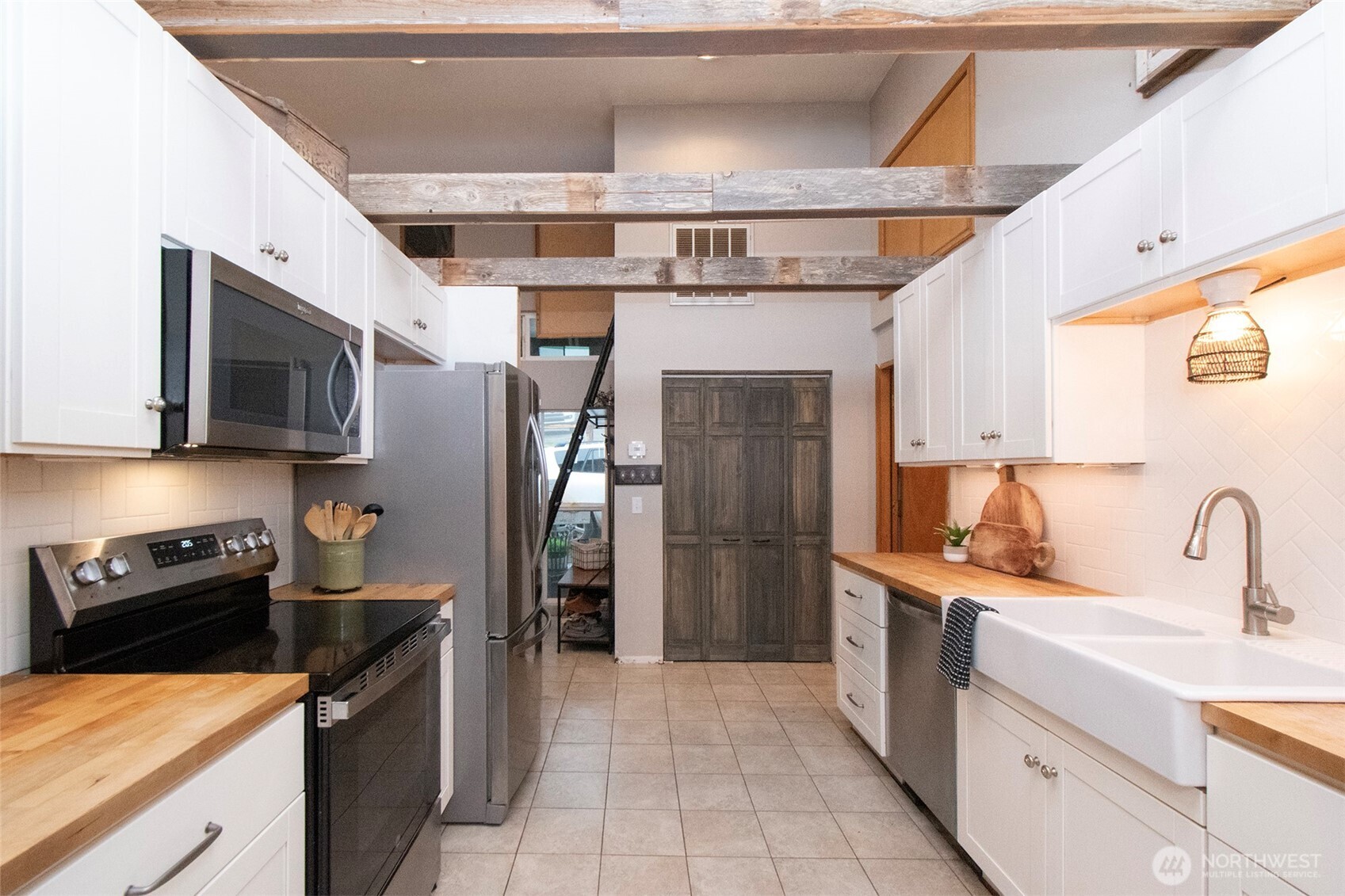 1515 Olson Road Sequim, WA 98382 - Photo 13 of 40 a kitchen with stainless steel appliances granite countertop a refrigerator a stove top oven a sink and dishwasher