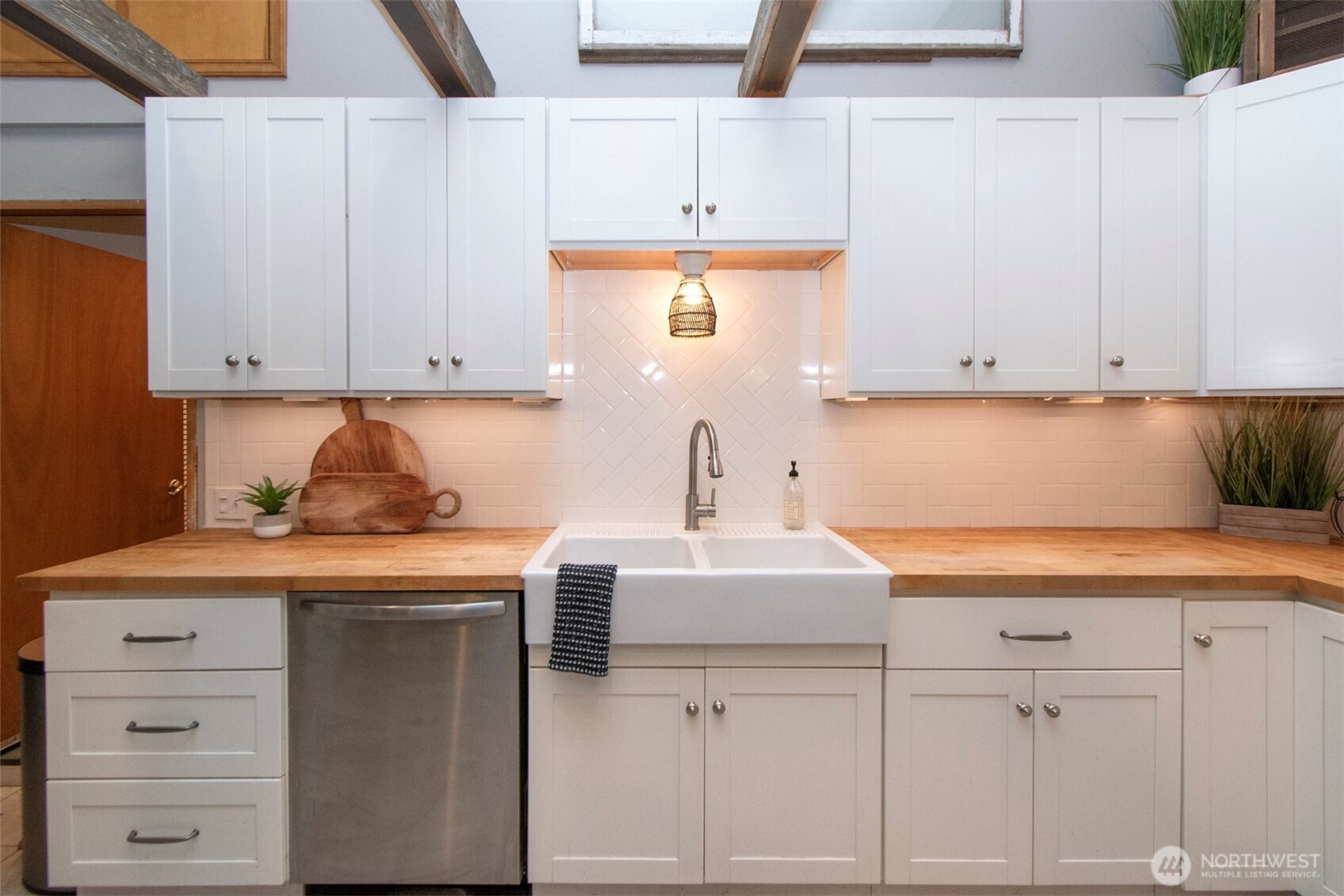 1515 Olson Road Sequim, WA 98382 - Photo 15 of 40 a kitchen with cabinets and white appliances