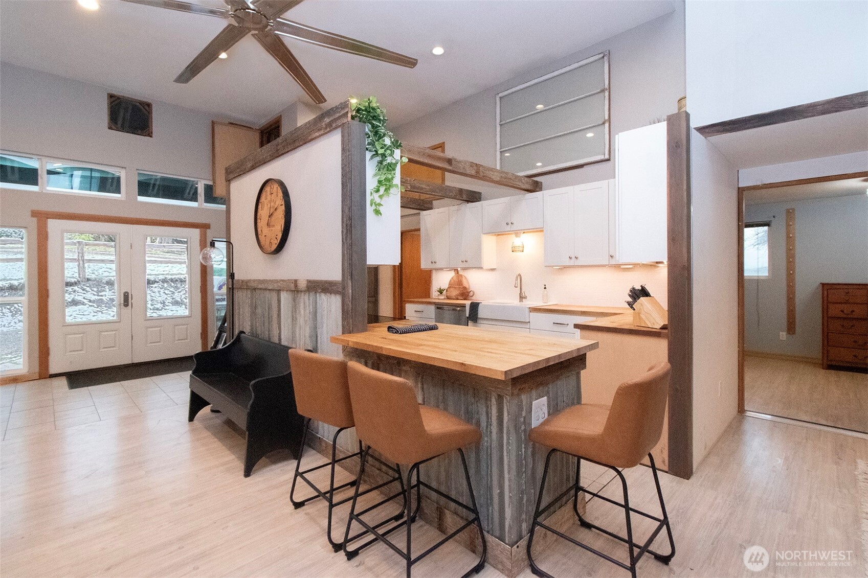 1515 Olson Road Sequim, WA 98382 - Photo 17 of 40 a dining hall with stainless steel appliances kitchen island a table and chairs