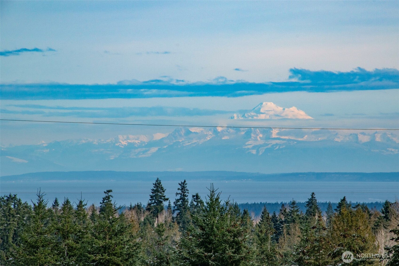 1515 Olson Road Sequim, WA 98382 - Photo 2 of 40 a view of a lake from a yard
