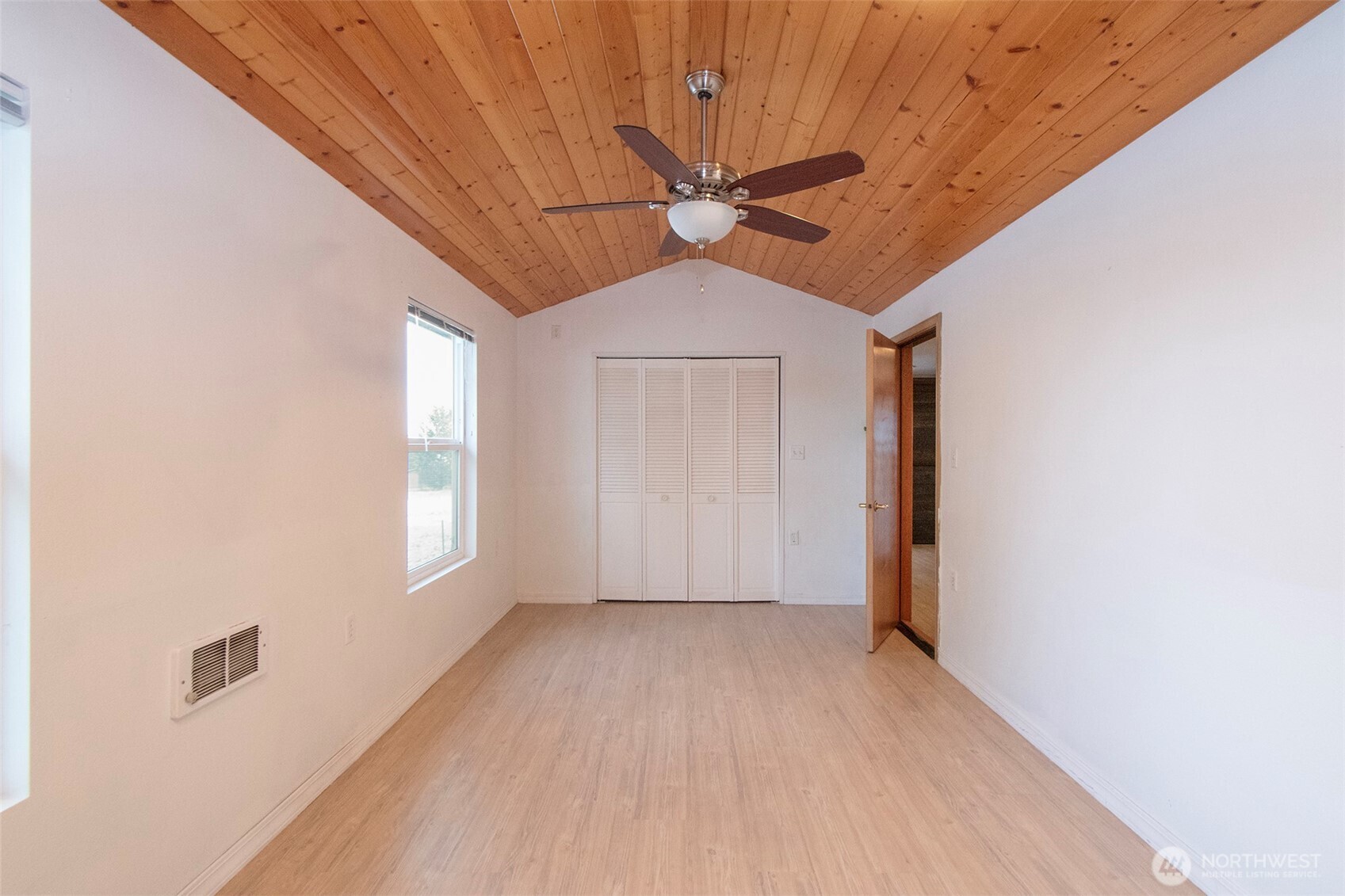 1515 Olson Road Sequim, WA 98382 - Photo 23 of 40 a view of empty room with wooden floor and fan