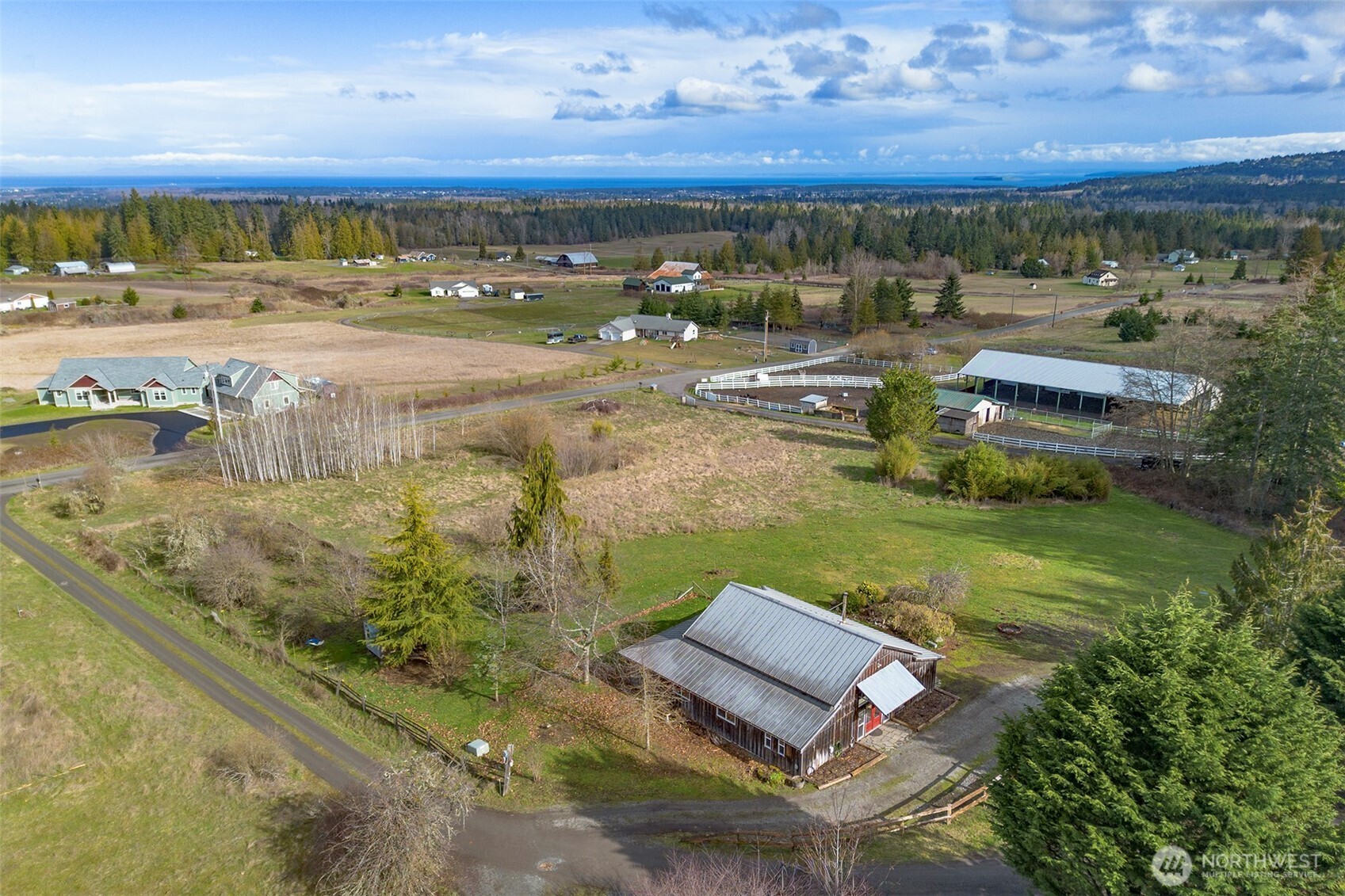 1515 Olson Road Sequim, WA 98382 - Photo 34 of 40 a view of a lake with a yard