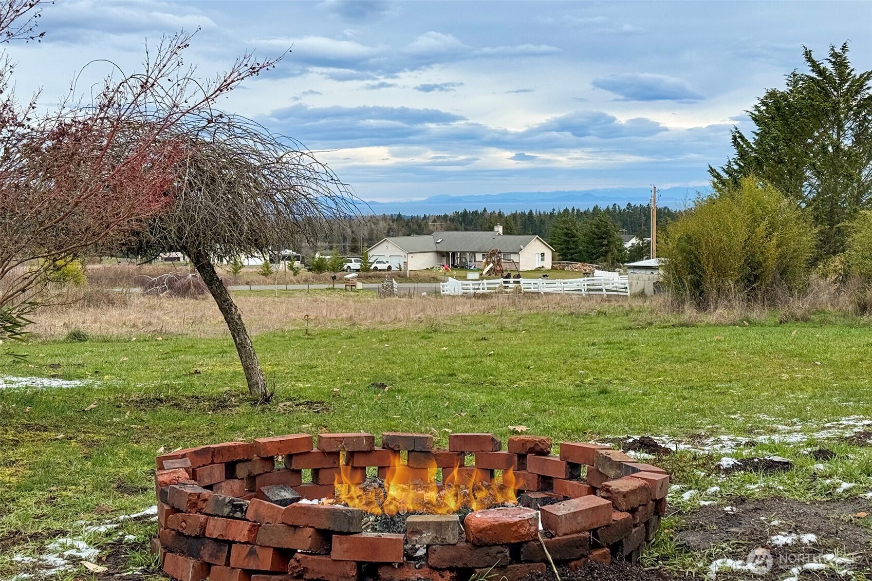 1515 Olson Road Sequim, WA 98382 - Photo 36 of 40 a view of a swimming pool and lounge chairs in the garden