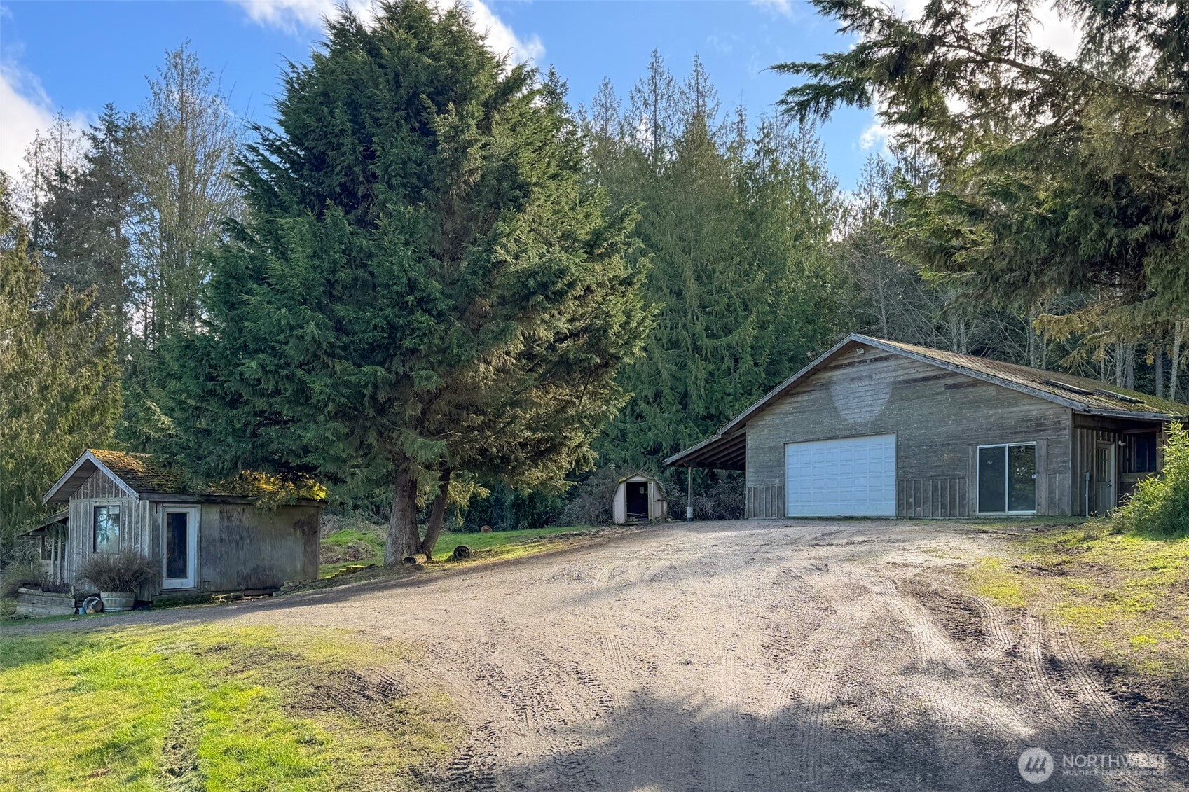 1515 Olson Road Sequim, WA 98382 - Photo 37 of 40 a white house that has a tree in front of it