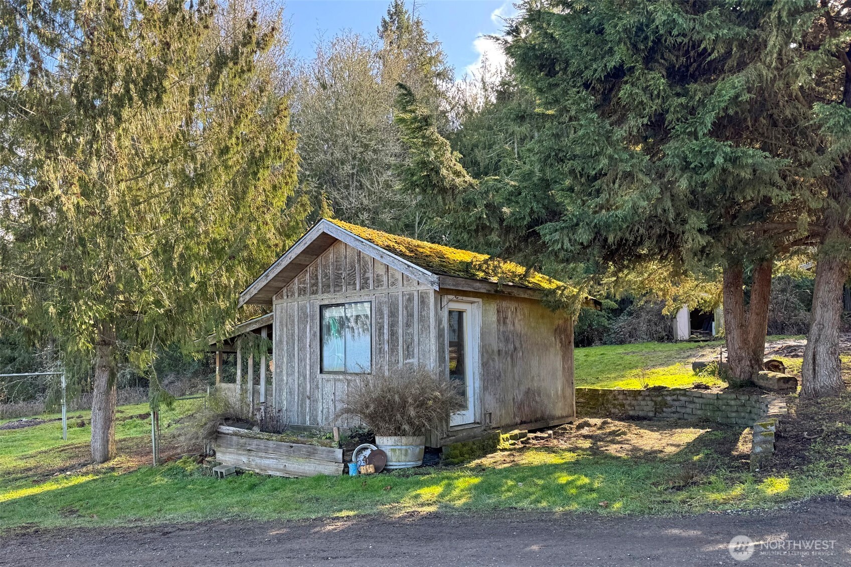 1515 Olson Road Sequim, WA 98382 - Photo 39 of 40 a front view of a house with a yard garage and outdoor seating
