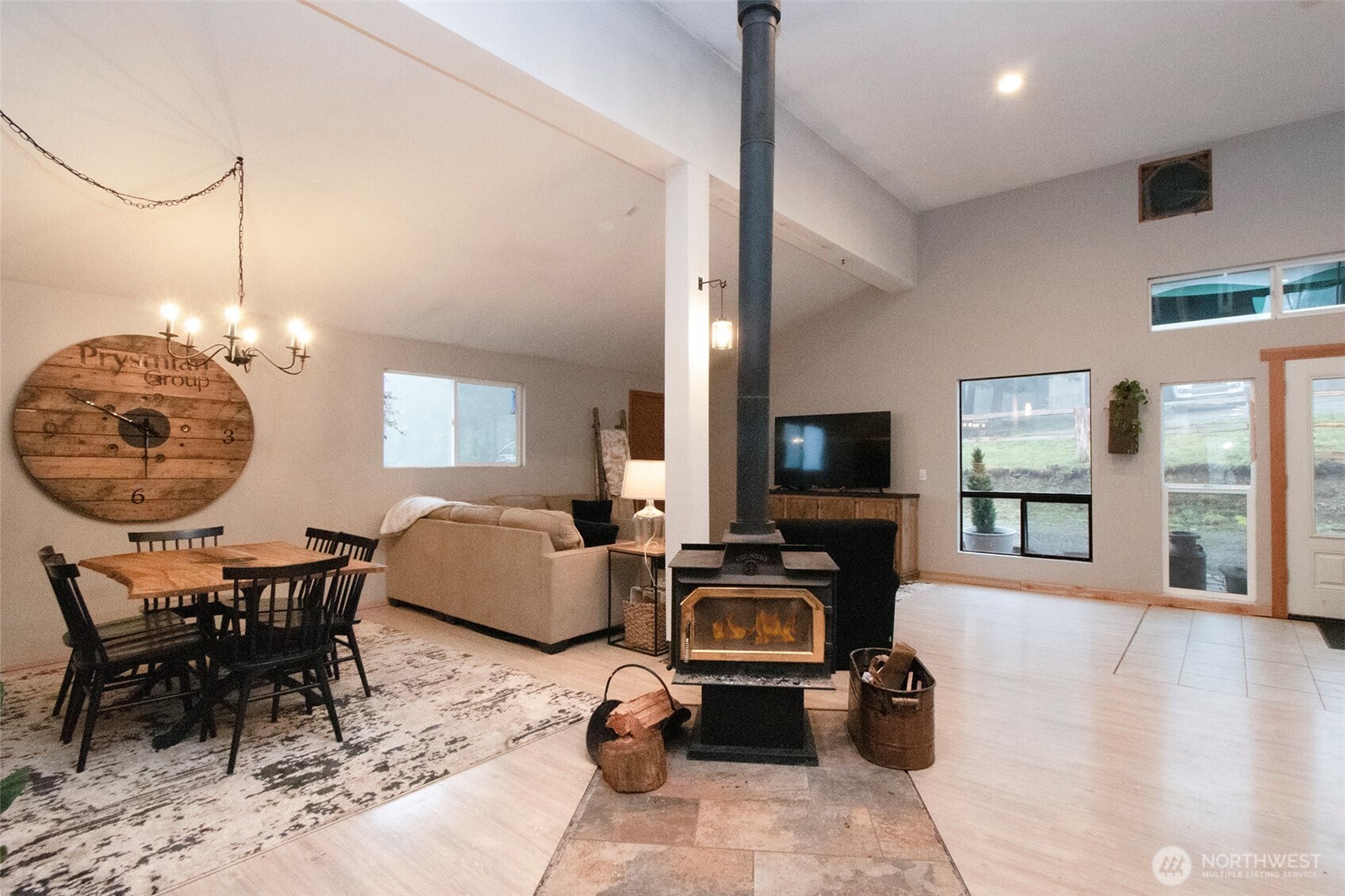 1515 Olson Road Sequim, WA 98382 - Photo 7 of 40 a living room with furniture a flat screen tv and a fireplace