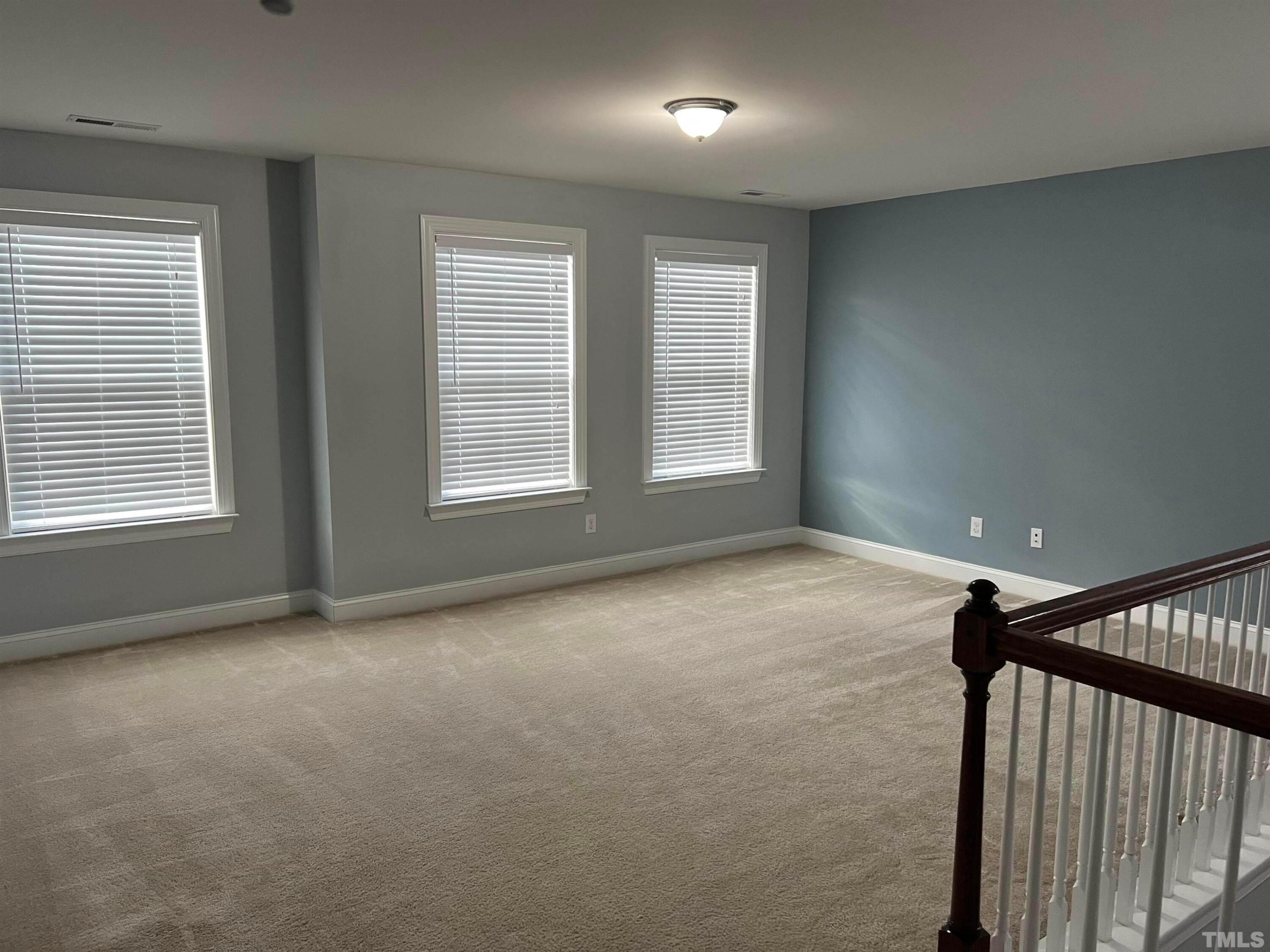 121 Red Bark Court Apex, NC 27539 - Photo 13 of 24 a view of an empty room with a window