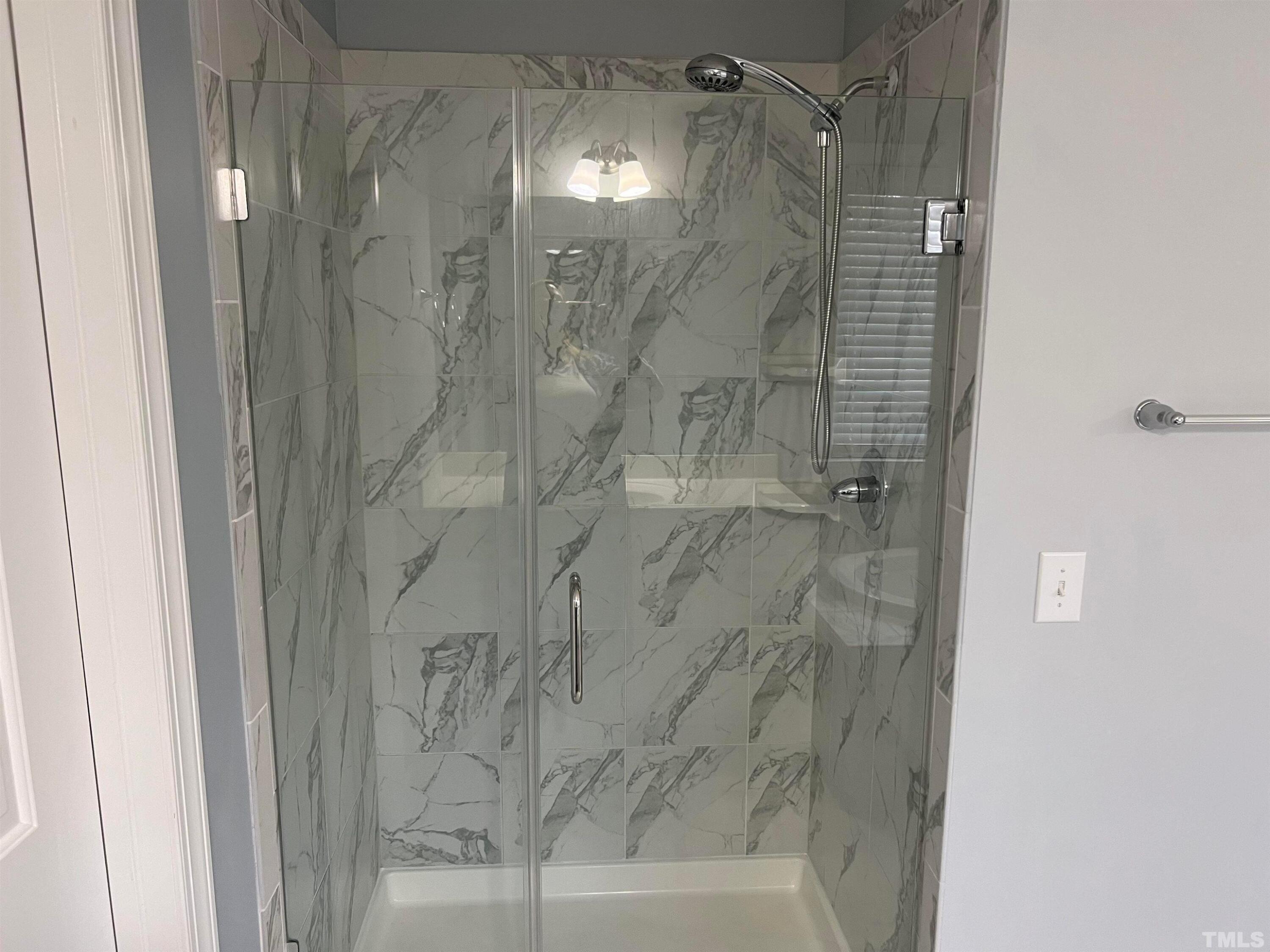 121 Red Bark Court Apex, NC 27539 - Photo 15 of 24 a bathroom with a shower