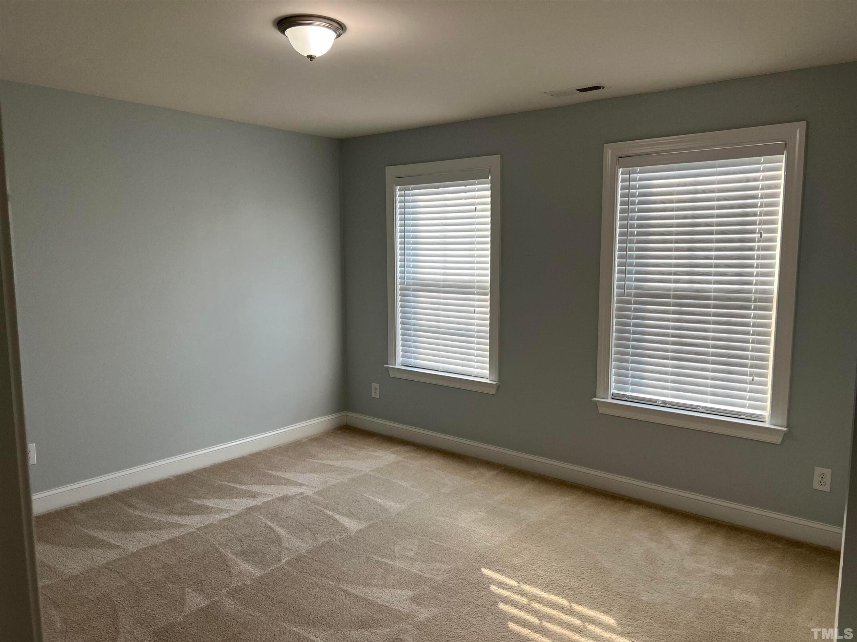 121 Red Bark Court Apex, NC 27539 - Photo 19 of 24 a view of an empty room with a window