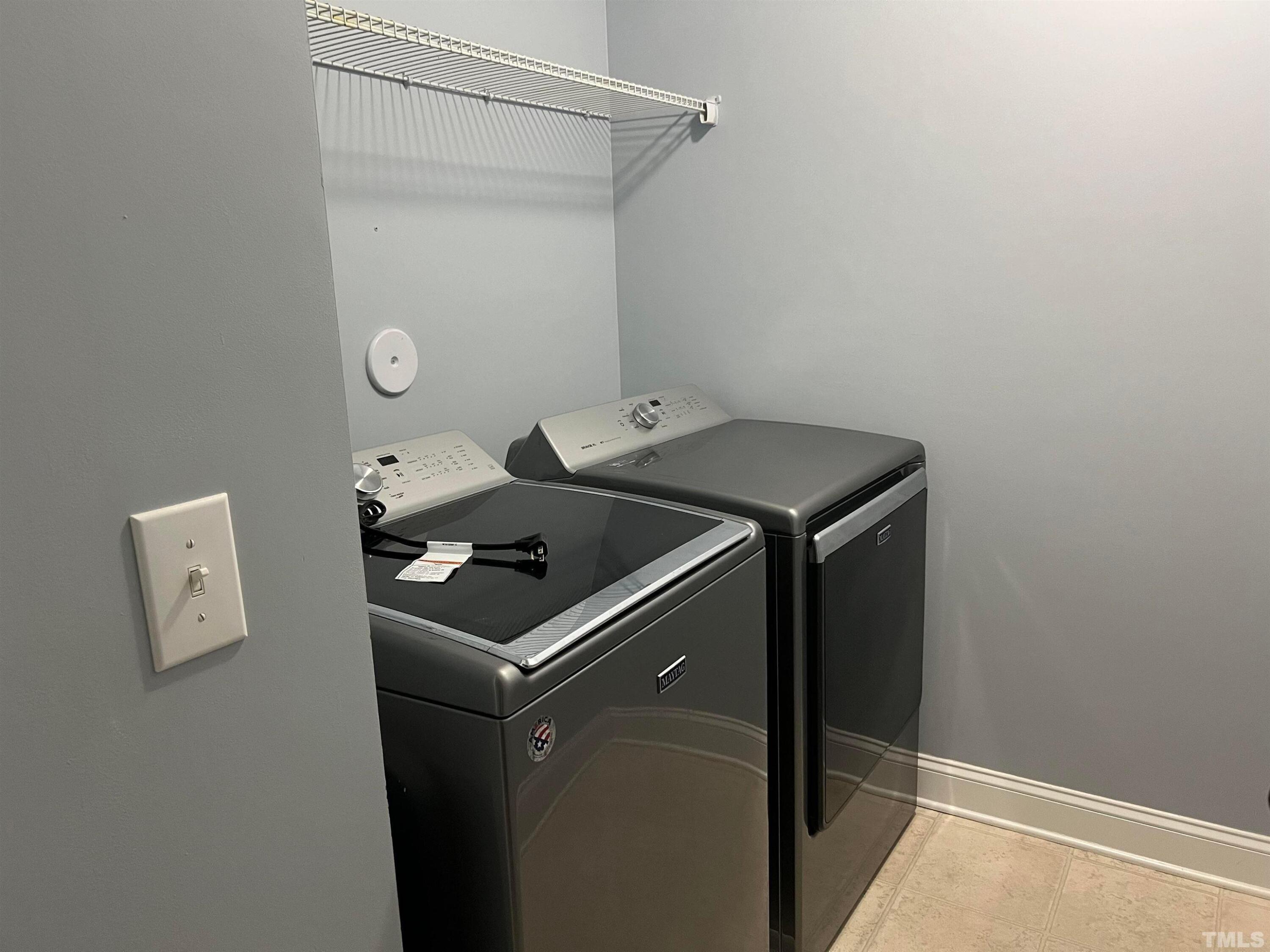 121 Red Bark Court Apex, NC 27539 - Photo 21 of 24 a utility room with washer and dryer
