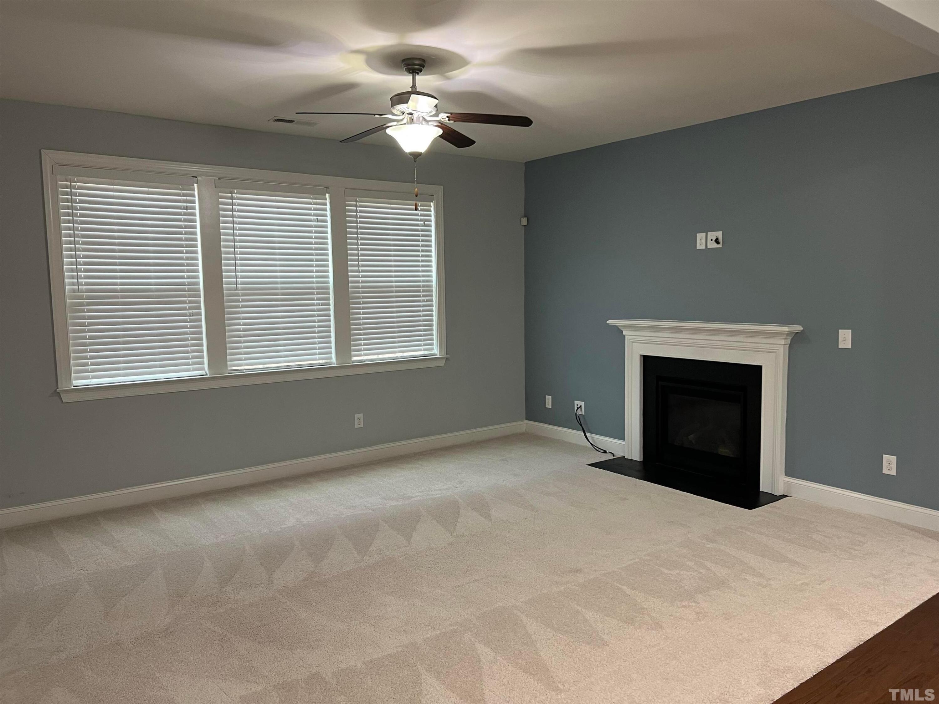 121 Red Bark Court Apex, NC 27539 - Photo 4 of 24 a view of an empty room with a window