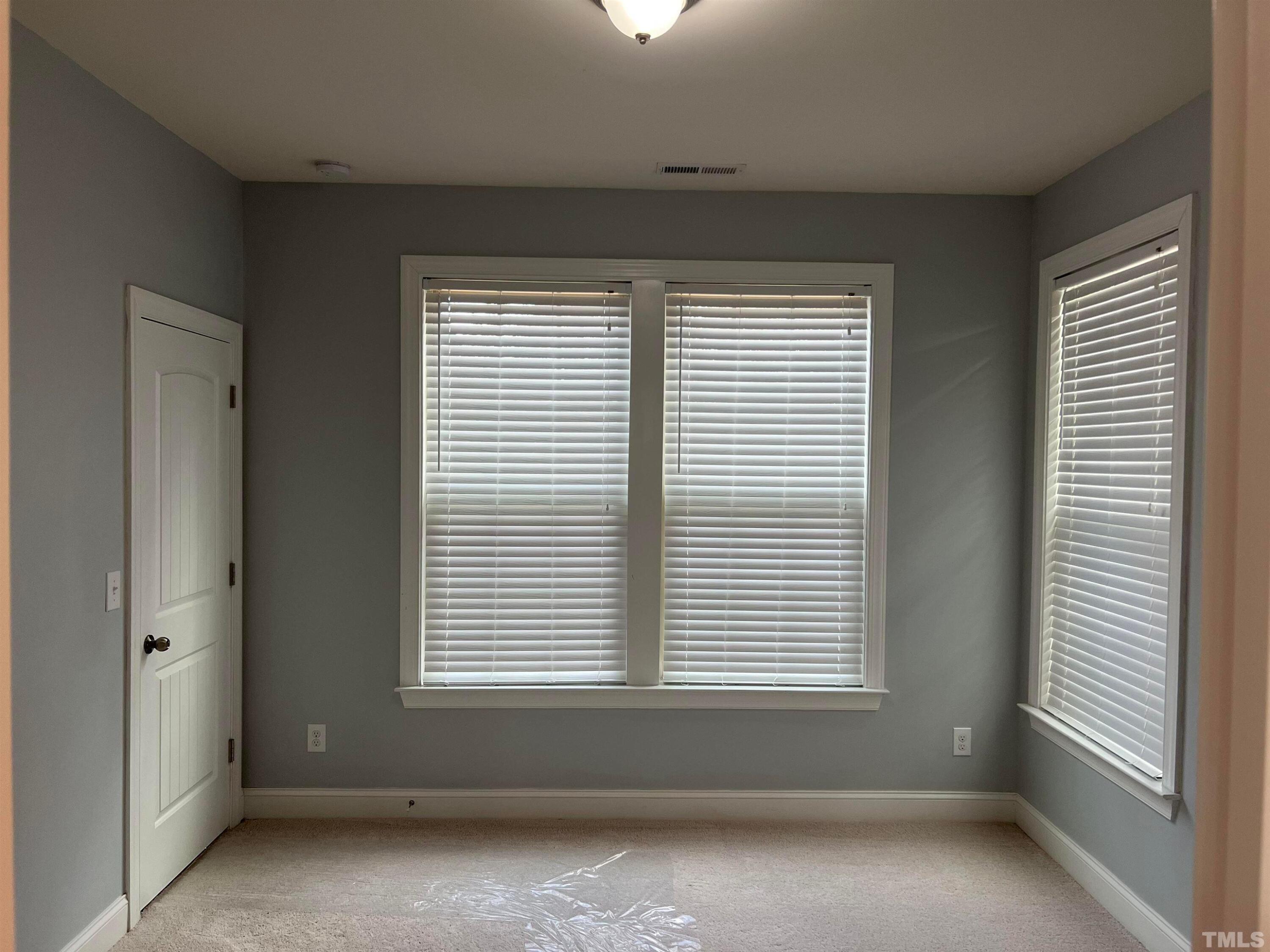 121 Red Bark Court Apex, NC 27539 - Photo 10 of 24 an empty room with a window