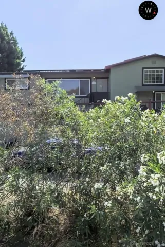 a view of a back yard from a balcony