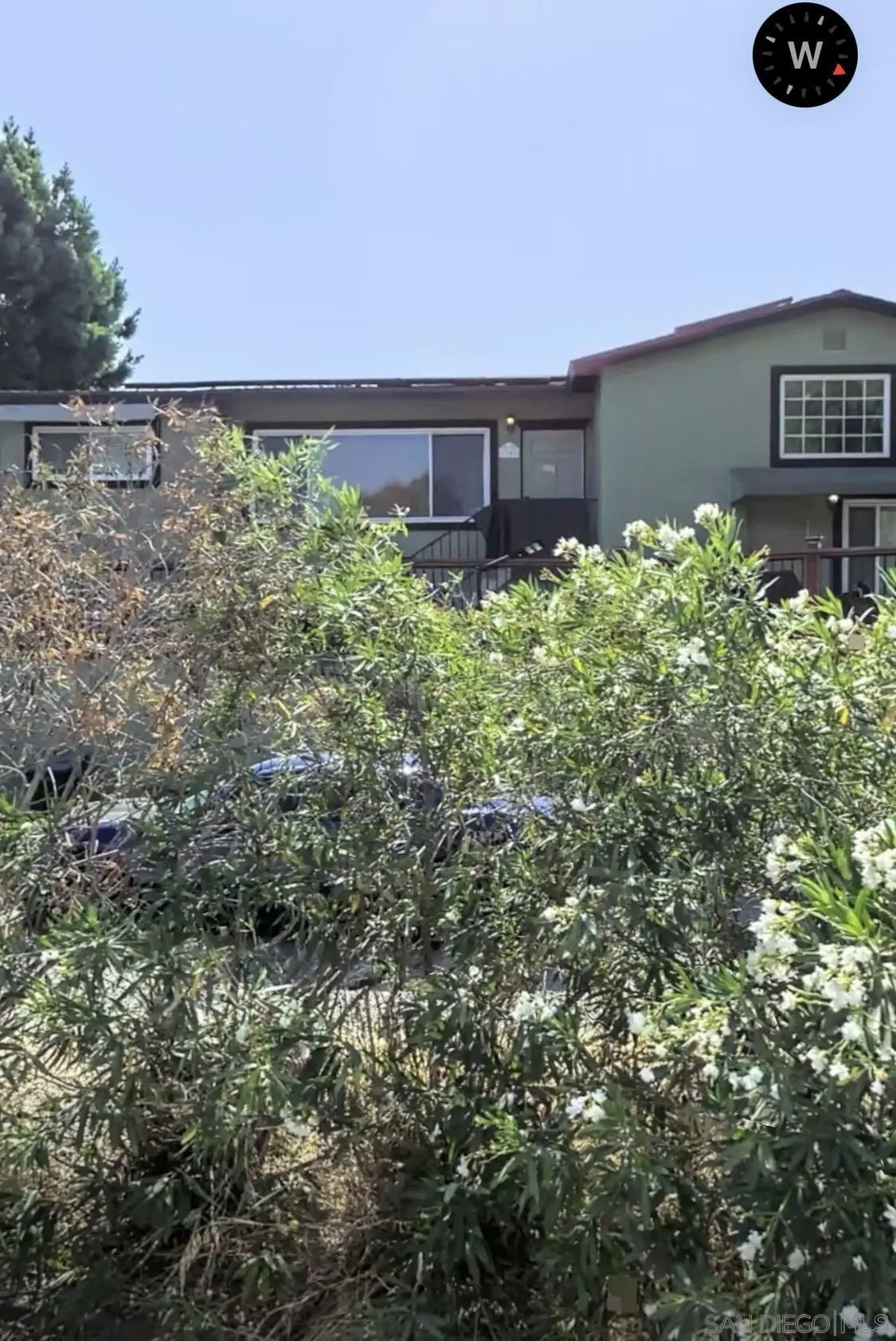 a view of a back yard from a balcony