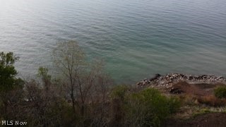 5467 Chapel Road Madison, OH 44057 - Photo 9 of 50 Expansive body of water with a rocky shoreline
