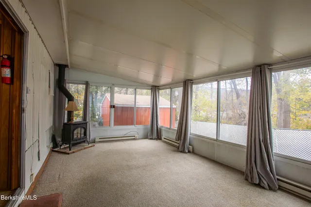 a view of an empty room and a balcony