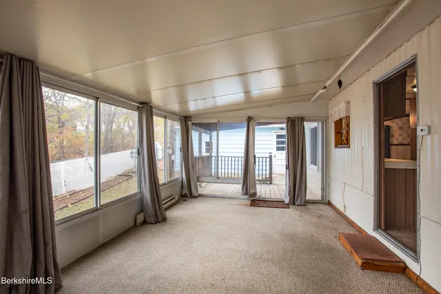 a view of an empty room with a sliding door