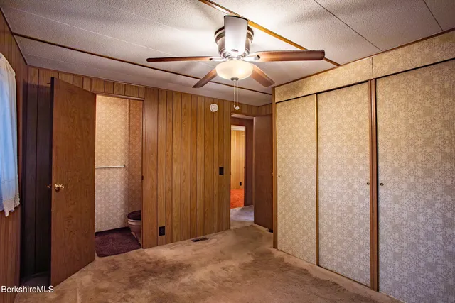 a view of a bedroom with a chandelier
