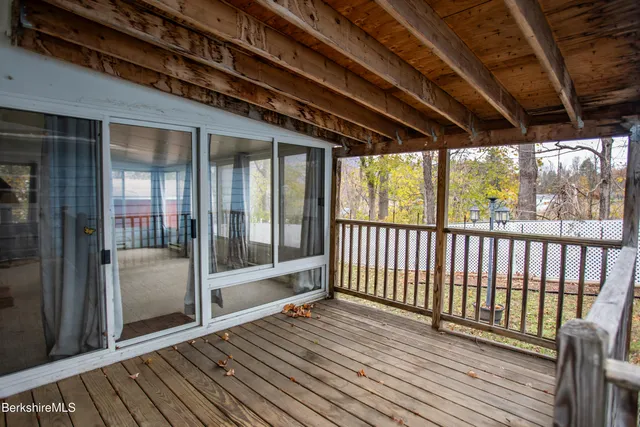 a view of a balcony with wooden floor